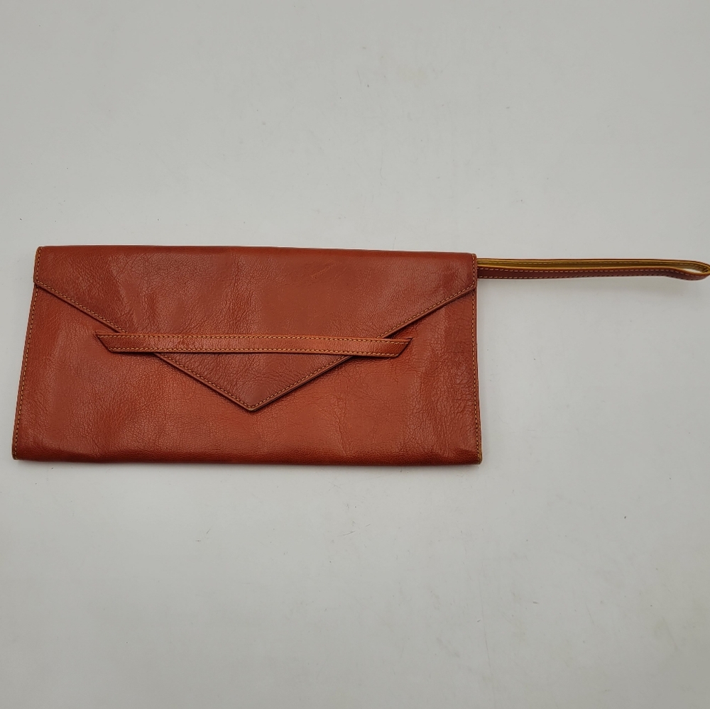 Tusk Wristlet Clutch Orange Leather Hidable Strap Statement Bag